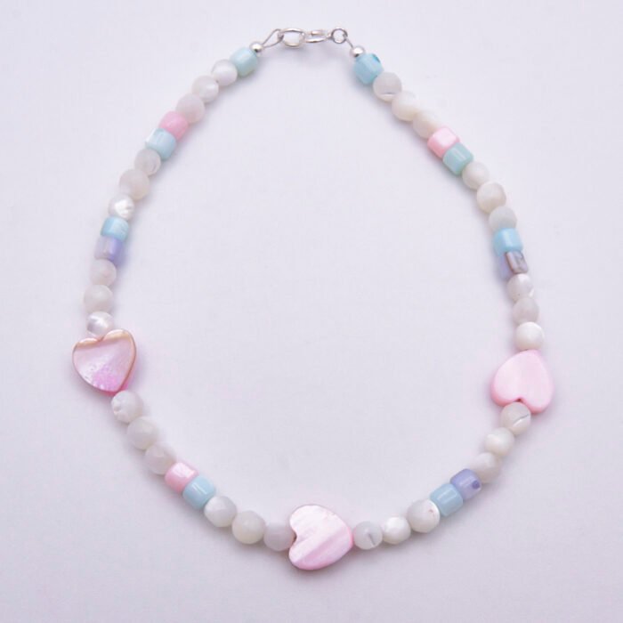 Mother of Pearl Heart Trio Bracelet shown from above on plain white background