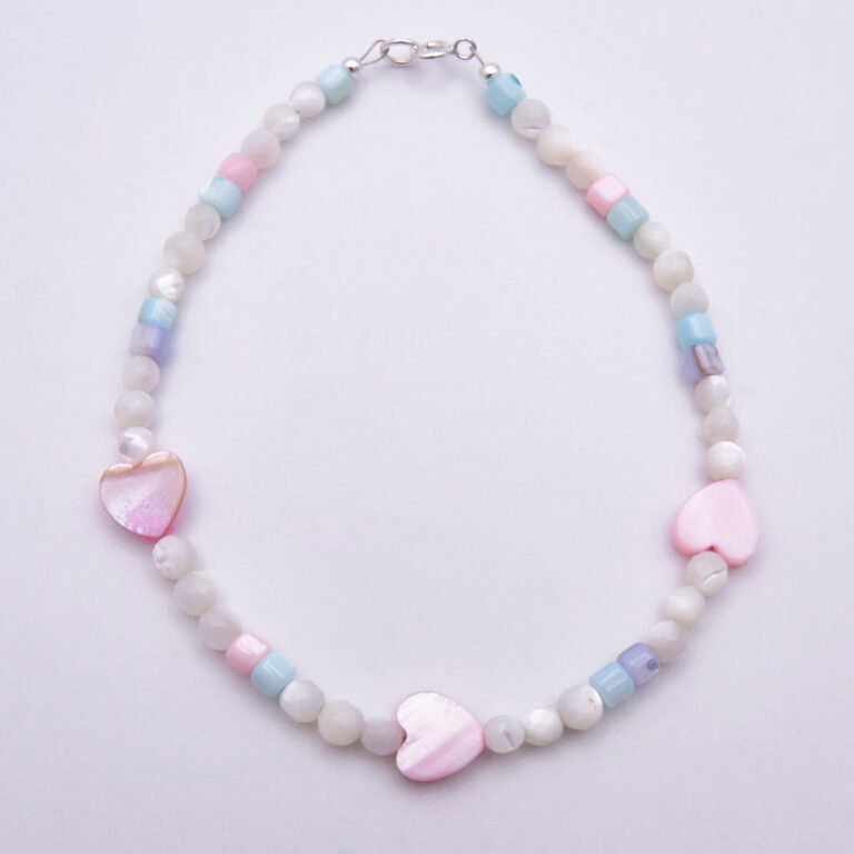 Mother of Pearl Heart Trio Bracelet shown from above on plain white background
