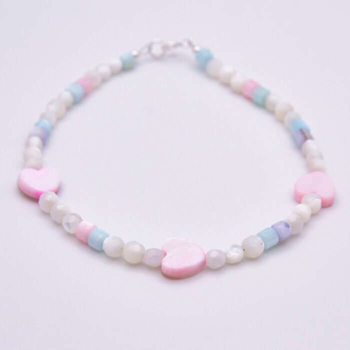 Mother of Pearl Heart Trio Bracelet shown on flat white surface
