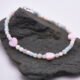Mother of Pearl Heart Trio Bracelet shown on dark grey stone