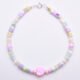 Mother of Pearl and Freshwater Pearl Single Heart Bracelet Mother of Pearl and Freshwater Pearl Heart Bracelet shown from above on flat white surface