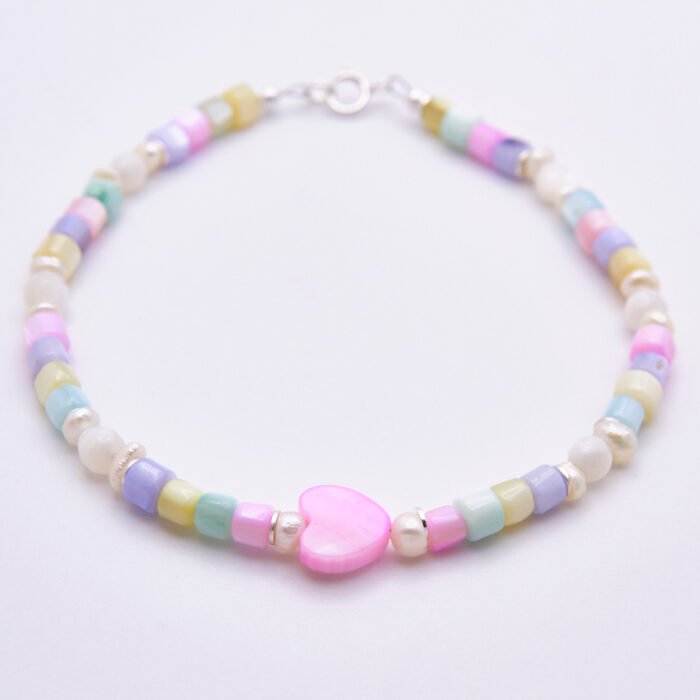 Mother of Pearl and Freshwater Pearl Single Heart Bracelet Mother of Pearl and Freshwater Pearl Single Heart Bracelet shown on flat white surface