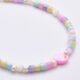 Mother of Pearl and Freshwater Pearl Single Heart Bracelet Mother of Pearl and Freshwater Pearl Single Heart Bracelet close up of beads on flat white surface