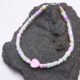Mother of Pearl and Freshwater Pearl Single Heart Bracelet Mother of Pearl and Freshwater Pearl Single Heart Bracelet shown on dark grey stone