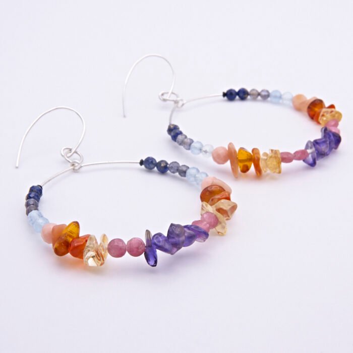 Mixed gemstone sterling silver large hoop earrings Mixed gemstone sterling silver large hoop earrings shown from the side on a flat white surface