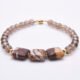 Zebra Jasper and Smoky Quartz Bracelet with Gold Filled Magnetic Clasp shown on plain white surface