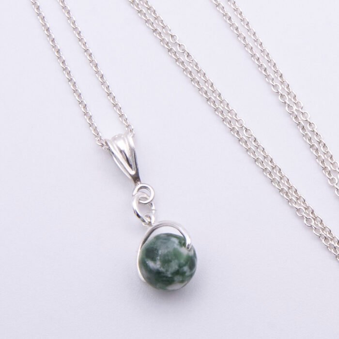 Green Spot Jasper Bead Pendant Necklace closer image of necklace laid flat on white surface