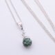 Green Spot Jasper Bead Pendant Necklace closer image of necklace laid flat on white surface