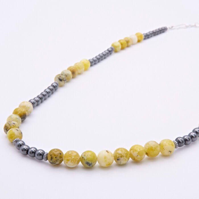 Yellow Turquoise and Hematite Necklace alternative view of beaded sections on flat white surface