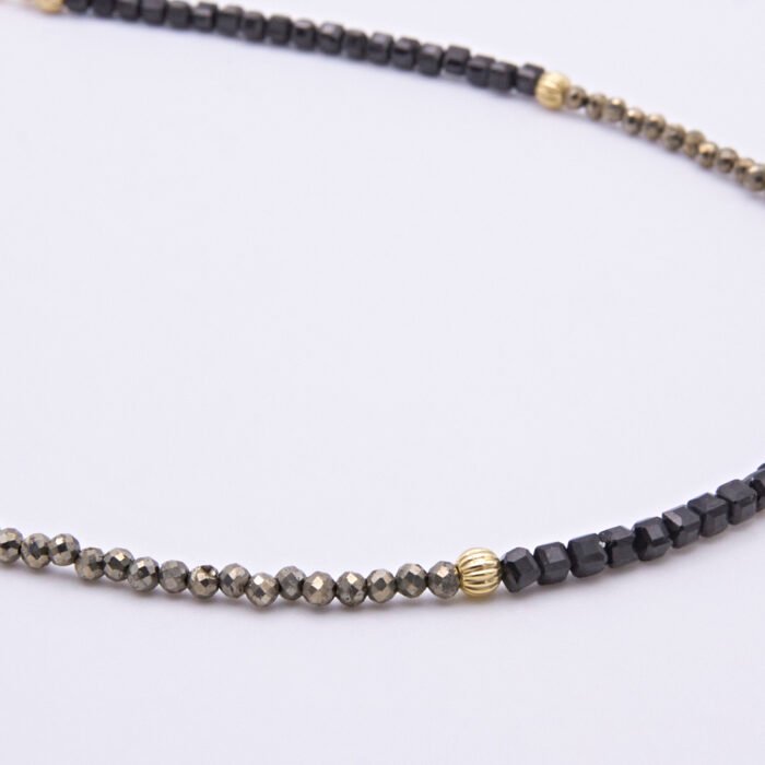 Black Spinel and Pyrite Necklace close up of Pyrite beaded section