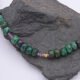 Ruby, Green Apatite and Ruby Zoisite Necklace close up of Ruby Zoisite beads on dark grey stone