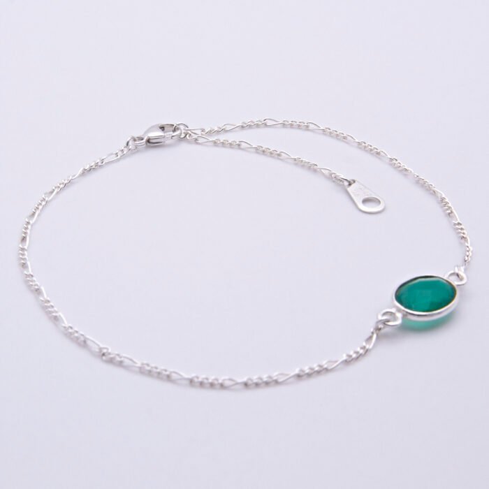 Sterling Silver Bezel-set Green Onyx Bracelet shown flat on white surface