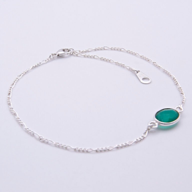 Sterling Silver Bezel-set Green Onyx Bracelet shown flat on white surface