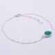 Sterling Silver Bezel-set Green Onyx Bracelet shown flat on white surface