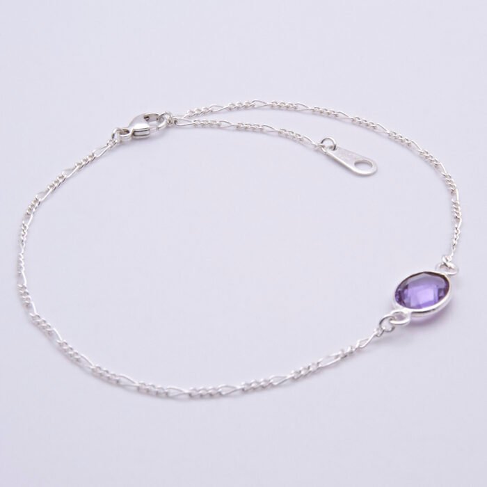 Sterling Silver Bezel-set Amethyst Bracelet shown on flat white surface