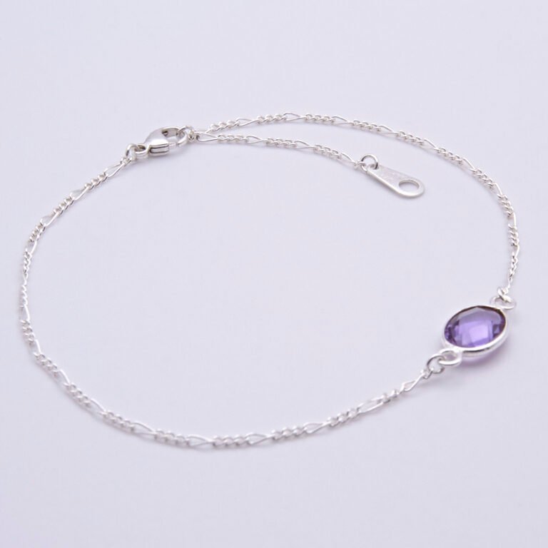 Sterling Silver Bezel-set Amethyst Bracelet shown on flat white surface