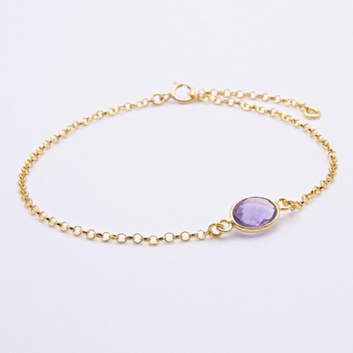 Amethyst and 24k Gold Plated Sterling Silver Bracelet shown on flat white surface