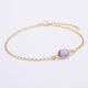 Amethyst and 24k Gold Plated Sterling Silver Bracelet shown on flat white surface
