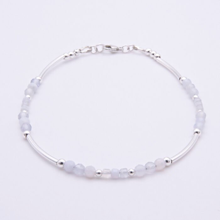 Blue Lace Agate and Sterling Silver Bracelet shown on flat white surface