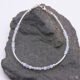 Blue Lace Agate and Sterling Silver Bracelet shown laid flat on dark grey stone
