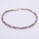 Ruby and Green Apatite Bracelet focus from front to back on flat white surface