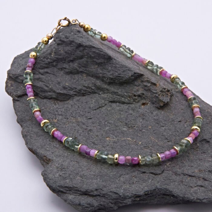 Ruby and Green Apatite Bracelet on grey stone