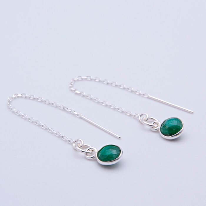 Emerald Sterling Silver Threader Earrings shown on white background with focus on sides of stones to reveal more of the bezel settings