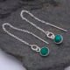 Emerald Sterling Silver Threader Earrings shown laid flat on a dark grey stone