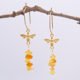 24k Gold Plated Sterling Silver Bee and Amber Hexagon Earrings shown hanging from twig