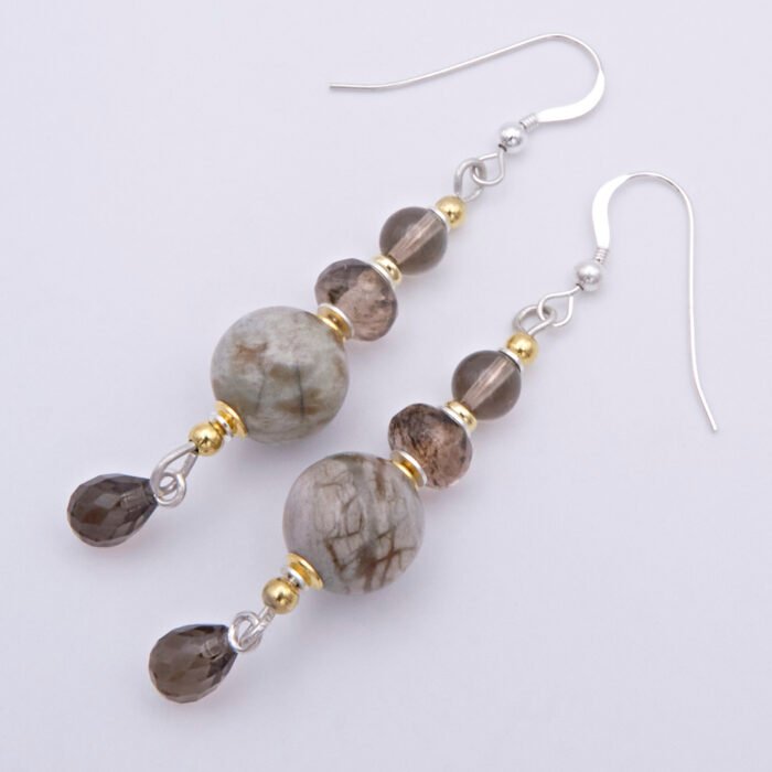 Picasso Jasper, Smoky Quartz and Smoky Watermelon Quartz mixed metals dangle earrings Picasso Jasper, Smoky Quartz and Smoky Watermelon Quartz mixed metals dangle earrings top down view on flat white surface