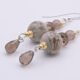 Picasso Jasper, Smoky Quartz and Smoky Watermelon Quartz mixed metals dangle earrings Picasso Jasper, Smoky Quartz and Smoky Watermelon Quartz mixed metals dangle earrings close up on flat white surface