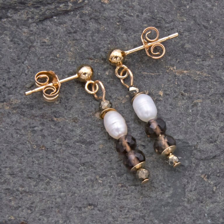 Freshwater Pearl, Smoky Quartz and Pyrite Gold Filled Earrings Freshwater Pearl, Smoky Quartz and Pyrite Gold Filled Earrings shown lying flat on grey stone