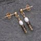 Freshwater Pearl, Smoky Quartz and Pyrite Gold Filled Earrings Freshwater Pearl, Smoky Quartz and Pyrite Gold Filled Earrings shown lying flat on grey stone