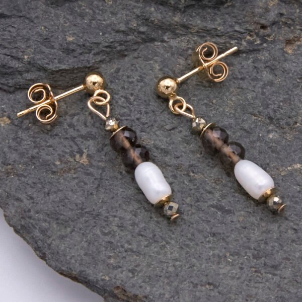 Smoky Quartz, Pyrite and Freshwater Rice Pearl Dangles on Gold Filled Ear Posts with Ball Stud at end, shown laid flat on dark grey stone