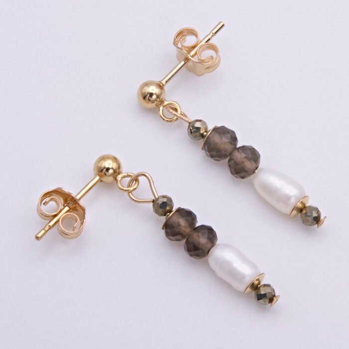 Smoky Quartz, Pyrite and Freshwater Rice Pearl Dangles on Gold Filled Ear Studs Smoky Quartz, Pyrite and Freshwater Rice Pearl Dangles on Gold Filled Ear Studs shown from above on flat white surface