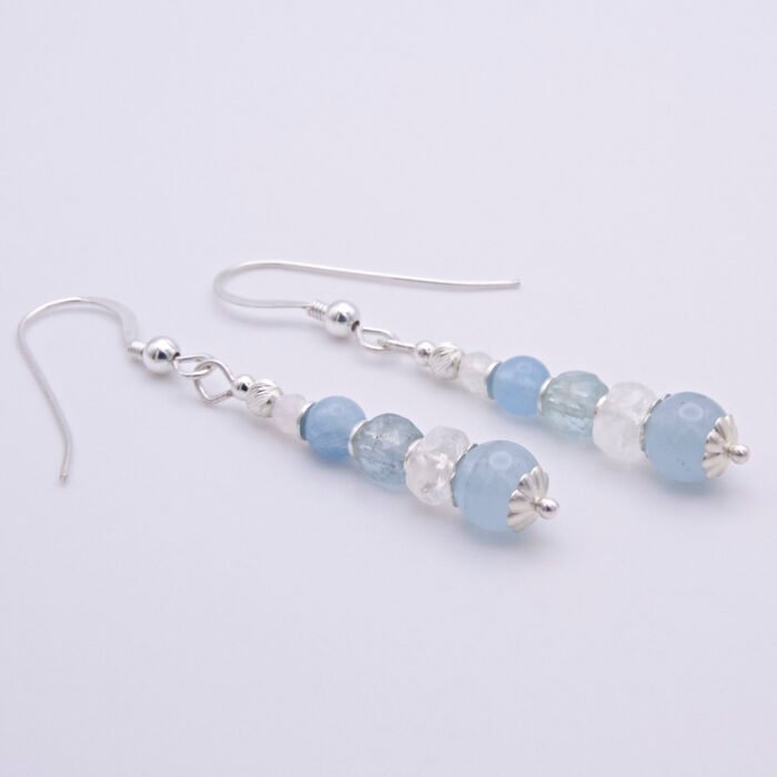 Aquamarine and Rainbow Moonstone Sterling Silver Earrings laid flat, side view