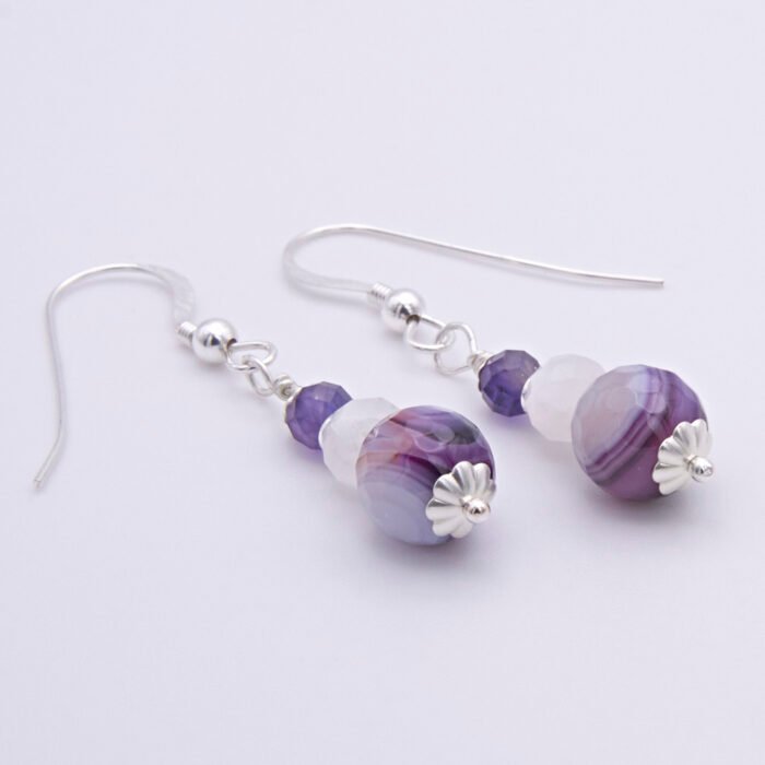 Purple Banded Agate, Rainbow Moonstone and Amethyst Sterling Silver Drop Earrings Purple Banded Agate, Rainbow Moonstone and Amethyst Sterling Silver Drop Earrings shown on flat white surface with focus on agates and bead caps
