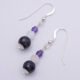 Amethyst, Rainbow Moonstone and Purple Banded Agate Stack Drop Sterling Silver Earrings shown on plain white surface, viewed from above