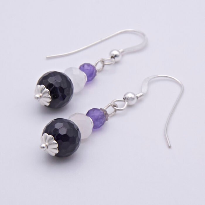 Amethyst, Rainbow Moonstone and Purple Banded Agate Stack Drop Sterling Silver Earrings shown on plain white surface showing the agates and bead caps