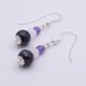 Amethyst, Rainbow Moonstone and Purple Banded Agate Stack Drop Sterling Silver Earrings shown on plain white surface showing the agates and bead caps