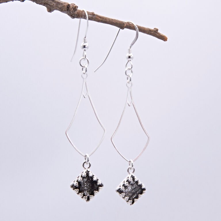 Tourmalinated Quartz and Sterling Silver Dangle Earrings shown hanging from twig
