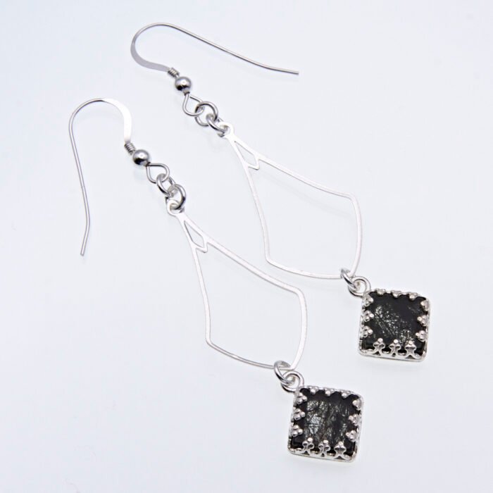 Tourmalinated Quartz Dangle Earrings showing earrings in flat white surface viewed from above