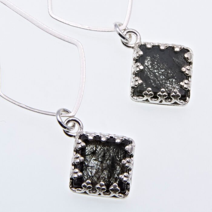 Tourmalinated Quartz Dangle Earrings showing close up view of bezel set stones from above