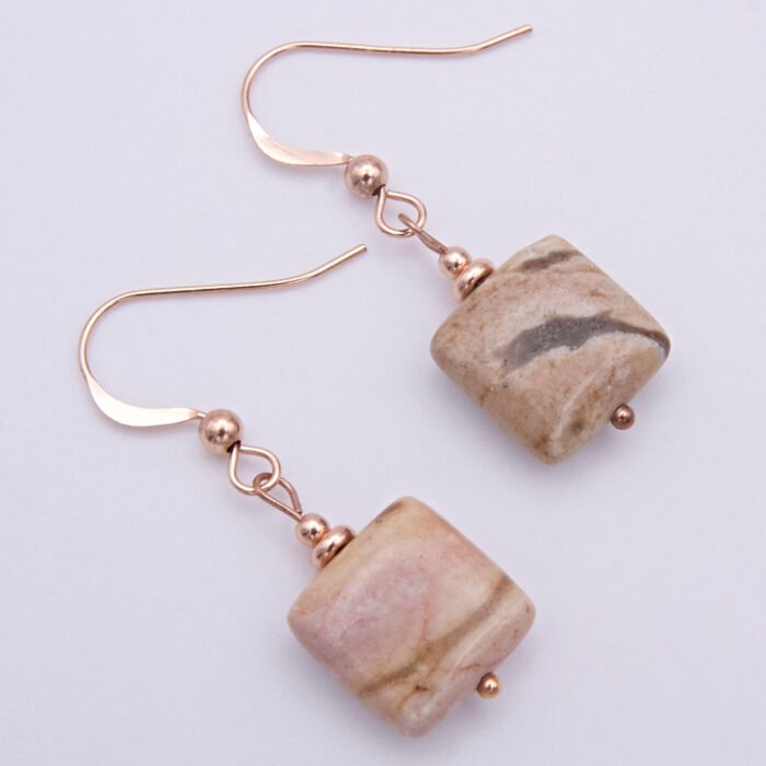 Zebra Jasper Rose Gold Filled Earrings showing other side of Zebra Jasper stones viewed from above on flat white surface