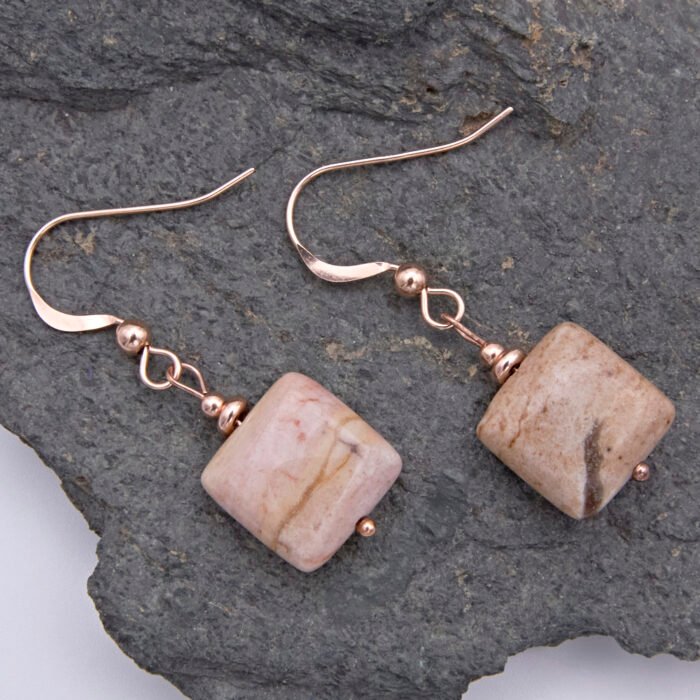Zebra Jasper Rose Gold Filled Earrings shown from above on dark grey stone