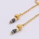 Black Spinel, Pyrite and Gold Vermeil Hinged Earhoop Dangles Black Spinel, Pyrite and Gold Vermeil Hinged Earhoop Dangles close up of bead stacks on flat white surface