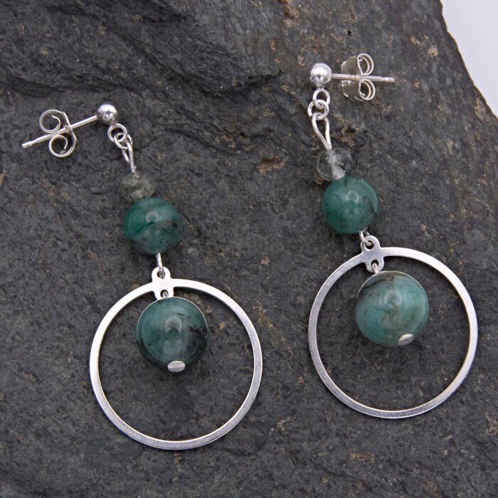 Emerald and Moss Quartz Sterling Silver Hoop Dangle Earrings viewed from above laid on dark grey stone
