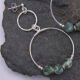 Green Spot Jasper Two-Hoop Sterling Silver Earrings close up of earring on dark grey stone