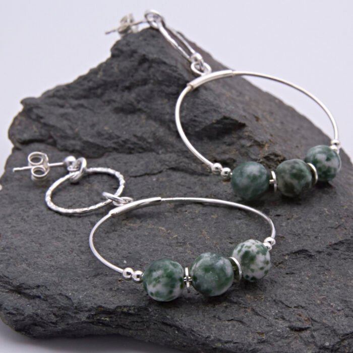 Green Spot Jasper Two-Hoop Sterling Silver Earrings showing both earrings on dark grey stone