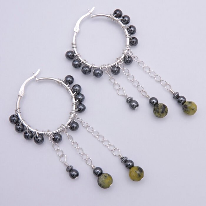 Yellow Turquoise and Hematite Wire-wrapped Hinged Hoop Dangle Sterling Silver Earrings shown from above on flat white surface